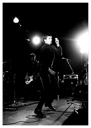 Joy Division - Leigh Open Air Pop Festival, Lancs, 27 August 1979; image by Kevin Cummins taken from 'Joy Division by Kevin Cummins'